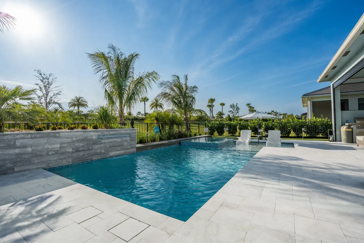 Gunite pool and raised spa with spillover